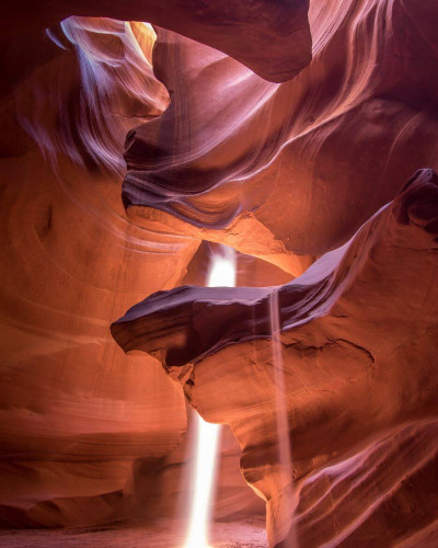 Antelope canyon lit by sunbeams